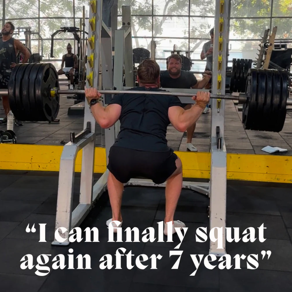 Lifestyle scene of an athlete squatting a barbell with a quote about the Muscle & Joint Builder Balm