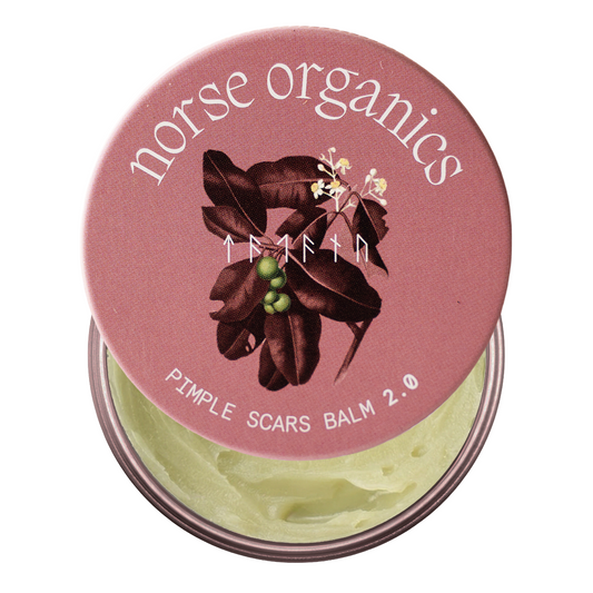 Open Pimple Scars Balm 2.0 tin with pink botanical lid art and green natural balm for acne scars